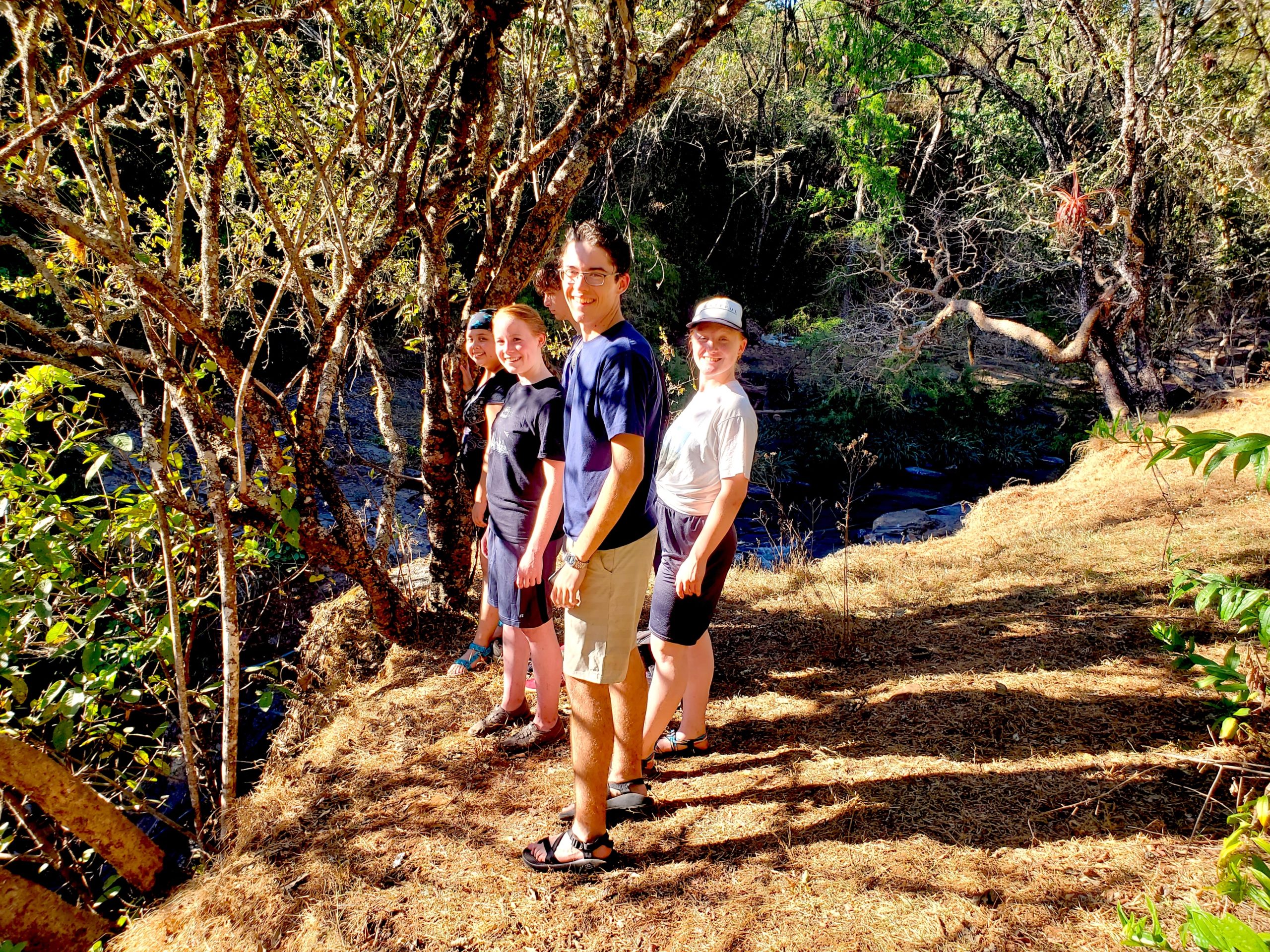 dts team above waterfall considering jumping-crop
